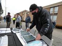 Dartmouth police officer Scott Affonce, looks at the maps outlining the search for Kenneth Parks who was reported missing Wednesday afternoon in Fairhaven. Mr. Parks was found by a homeowner sitting in her car parked in her driveway on Chestnut Street.