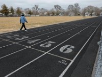 A woman walks around the track at Cushman Park, the last place that Kenneth Parks was seen, before he was reported missing Wednesday afternoon in Fairhaven. Mr. Parks was found by a homeowner sitting in her car parked in her driveway on Chestnut Street.