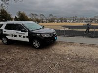 A Fairhaven police officer drives by Cushman Park in Fairhaven, the last place that Kenneth Parks was seen, before he was reported missing Wednesday afternoon. Mr. Parks was found by a homeowner sitting in her car parked in her driveway on Chestnut Street.