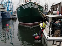 A diver makes his way into the waters behind Lindbergh Marine in search for Kenneth Parks who was reported missing Wednesday afternoon in Fairhaven. Mr. Parks was found by a homeowner sitting in her car parked in her driveway on Chestnut Street.