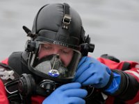 Pembroke police officer, Billy Marsh, prepares to dive into the waters off of Fairhaven in search for Kenneth Parks who was reported missing Wednesday afternoon Mr. Parks was found by a homeowner sitting in her car parked in her driveway on Chestnut Street.