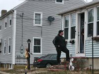 A Sheriff Department officer speaks with a resident during the search for Kenneth Parks who was reported missing Wednesday afternoon in Fairhaven. Mr. Parks was found by a homeowner sitting in her car parked in her driveway on Chestnut Street.