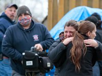 Two Better Community Living employees weep with relief after Kenneth Parks was found by a homeowner sitting in her car parked in her driveway on Chestnut Street in Fairhaven.