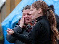 Two Better Community Living employees weep with relief after Kenneth Parks was found by a homeowner sitting in her car parked in her driveway on Chestnut Street in Fairhaven.