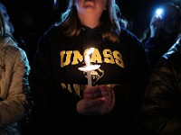 Umass Dartmouth students and staff hold candles during a candlelight vigil to honor Frankie Petillo Jr. who died after geing hit by a car, and Alexandra Landra who died unexpectedly in a separate incident.