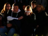 The parents of Franke Petillo Jr. weep during a Umass Dartmouth candlelight vigil to honor Frankie Petillo Jr. who died after geing hit by a car, and Alexandra Landra who died unexpectedly in a separate incident.