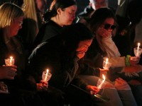 Lauren Petillo, sister of Frankie Petillo Jr., breaks down during a Umass Dartmouth candlelight vigil to honor Frankie Petillo Jr. who died after geing hit by a car, and Alexandra Landra who died unexpectedly in a separate incident.