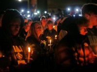 Umass Dartmouth students and staff hold candles during a candlelight vigil to honor Frankie Petillo Jr. who died after geing hit by a car, and Alexandra Landra who died unexpectedly in a separate incident.