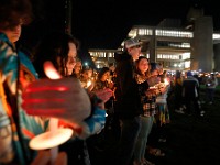 Umass Dartmouth students and staff hold candles during a candlelight vigil to honor Frankie Petillo Jr. who died after geing hit by a car, and Alexandra Landra who died unexpectedly in a separate incident.