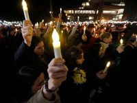 Umass Dartmouth students and staff hold candles during a candlelight vigil to honor Frankie Petillo Jr. who died after geing hit by a car, and Alexandra Landra who died unexpectedly in a separate incident.