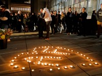 Umass Dartmouth students and staff seek comfort in each other during a candlelight vigil to honor Frankie Petillo Jr. who died after geing hit by a car, and Alexandra Landra who died unexpectedly in a separate incident.