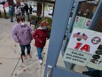 Voters line up outside the Normandin Middle School polling station in New Bedford to cast their ballots for the 2020 Presidential election.  [ PETER PEREIRA/THE STANDARD-TIMES/SCMG ]