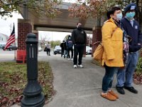 Voters line up outside the Normandin Middle School polling station in New Bedford to cast their ballots for the 2020 Presidential election.  [ PETER PEREIRA/THE STANDARD-TIMES/SCMG ]