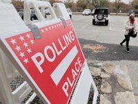 A voter makes her way into the Dartmouth Town Hall polling station to cast her vote in the 2020 Presidential election.  [ PETER PEREIRA/THE STANDARD-TIMES/SCMG ]