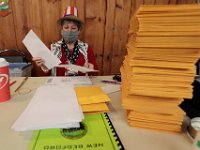 Warden Lucy Leitao, counts the stack of absentee ballots she received at the Buttonwood Warming House polling station in New Bedford.   [ PETER PEREIRA/THE STANDARD-TIMES/SCMG ]