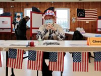 Poll workers get into the spirit of the occasion inside of the Buttonwood warming house polling station in New Bedford.