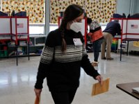 Voters cast their ballots inside the gym of the Hathaway school in New Bedford.   [ PETER PEREIRA/THE STANDARD-TIMES/SCMG ]