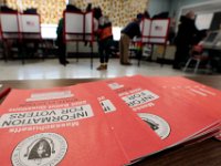 Voters cast their ballots inside the gym of the Hathaway school in New Bedford.   [ PETER PEREIRA/THE STANDARD-TIMES/SCMG ]