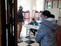 Voters check-in at the New Bedford Hotel Apts. polling staion in New Bedford.  [ PETER PEREIRA/THE STANDARD-TIMES/SCMG ]