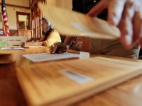 Warden Bernadette Costa and Nils Isaksen count the absentee ballots inside of the Fairhaven Town Hall polling station.   [ PETER PEREIRA/THE STANDARD-TIMES/SCMG ]