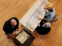 A voter casts his ballot for the 2020 Presidential election at the Fairhaven Town Hall polling station.  [ PETER PEREIRA/THE STANDARD-TIMES/SCMG ]