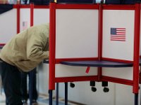 A man casts his vote at the Normandin Middle Scholl polling station in New Bedford.   [ PETER PEREIRA/THE STANDARD-TIMES/SCMG ]