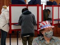 Voters cast their ballots at the Buttonwood Warming House polling station in New Bedford.   [ PETER PEREIRA/THE STANDARD-TIMES/SCMG ]