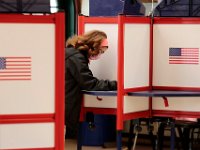 First time voter, Alexia Vieira, casts her first vote at the Buttonwood Warming House polling station in New Bedford.  [ PETER PEREIRA/THE STANDARD-TIMES/SCMG ]