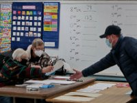 A running tally of voter count by the hour can be seen on the whiteboard at the Dartmouth Town Hall voting station.  [ PETER PEREIRA/THE STANDARD-TIMES/SCMG ]