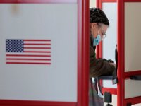 A man casts his vote at the Normandin Middle Scholl polling station in New Bedford.   [ PETER PEREIRA/THE STANDARD-TIMES/SCMG ]