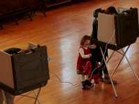 A young girl waits for her mother to cast her vote at the Fairhaven Town Hall polling staion.  [ PETER PEREIRA/THE STANDARD-TIMES/SCMG ]