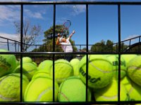 Hank DePina works on his serve using a basket filled with over three hundred tennis balls at Fort Phoenix in Fairhaven, MA on September 7, 2016.