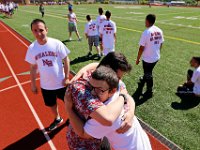 Jacob Mills and Austin Botelho embrace after completing the hurdles event at Special Olympics School Day Games held at the New Bedford High School track on June 8, 2016.  The games features athletes from New Bedford High School and the city's three middle schools.