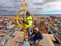 Pauly Reed, Supervisor and Michael Gnazzo, president of Cenaxo install the freshly repaired iron cross atop of the new steeple of the Grace Episcopal Chuch on County Street in New Bedford, MA on November 16, 2016.   PETER PEREIRA/THE STANDARD-TIMES/SCMG