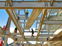 Iron workers install the decking for the second floor of the future Hannigan School on Emery Street in the south end of New Bedford.   PETER PEREIRA/THE STANDARD-TIMES/SCMG