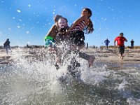 Jamie O'Driscoll and his newphew Connor Hebert, 7, and his twin sister Khloe Hebert, 7, cast themselves into the cold waters off of Gooseberry Island in Westport, MA for the annual Plunge of the Faithful in memory of Jamie's sister Shannon O'Driscoll, 24, who was killed November 2006 when she was struck by an SUV in Plainville, MA while holding a sign supporting state daycare centers.  PETER PEREIRA/THE STANDARD-TIMES/SCMG