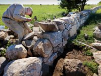 Bob French works on repairing a stone wall at the Mass Audubon's Allens Pond Wildlife Sanctuary on Horseneck Road in Westport, one stone at a time.  Mr. French has been rebuilding the stone walls of Westport since 1986.  He says "  New England has over 75,000 miles of stone walls, a feat not much different than building the pyramids of Egypt."  PETER PEREIRA/THE STANDARD-TIMES/SCMG