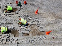 Fernando Conde, Joe Costa and Horace Medeiros repair the cobblestones on N. Water Street in downtown New Bedford.   PETER PEREIRA/THE STANDARD-TIMES/SCMG