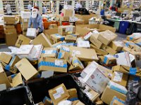 Jeff Chaves, gets into the spirit of things, as he and fellow postal carriers at the downtown New Bedford, MA post office, sort and prepare their route delivery carts on December 21, 2016,  the busiest day of the year for deliveries.   PETER PEREIRA/THE STANDARD-TIMES/SCMG