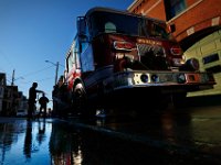 New Bedford firefighters Kevin Carvalho and Mark Pacheco wash Engine 6  truck in front of the Station 6 station on Purchase Street in the south end of the New Bedford as they clean their gear in preparation for the new year.   PETER PEREIRA/THE STANDARD-TIMES/SCMG