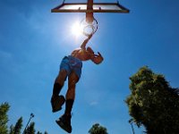 Emanuel Taylor Jr. doesn't let the heat keep him from working on his basketball skills at the Clasky Common Park court in New Bedford.   PETER PEREIRA/THE STANDARD-TIMES/SCMG