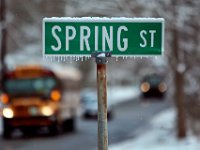 Icicles form at the bottom of the Spring Street sign in Dartmouth, MA as traffic makes its way by on a frigid morning.   PETER PEREIRA/THE STANDARD-TIMES/SCMG