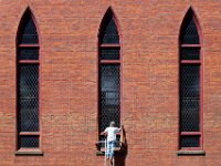 Fern Boudria of Fern Boudria & Sons Painting prepares the window sills of the First Congregational Church in Fairhaven for a fresh coat of paint.   PETER PEREIRA/THE STANDARD-TIMES/SCMG