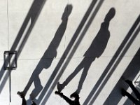 UMass Dartmouth students cast long shadows across the library entrance floor as they walk to class early in the morning.    PETER PEREIRA/THE STANDARD-TIMES/SCMG