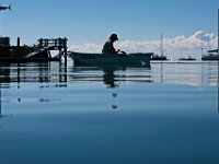 Don Calstrom rows his boat to the dock for the last time this season, as he prepares to remove it from the water, in Mattapoisett harbor on a perfectly still morning.   PETER PEREIRA/THE STANDARD-TIMES/SCMG