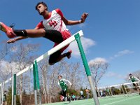 New Bedford's Marcus Barros, senior, runs the 100m hurdles.  Dartmouth High School takes on New Bedford High School track in Dartmouth.   PETER PEREIRA/THE STANDARD-TIMES/SCMG