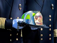 Somerset firefighters carry the helmet of Somerset Fire Chief Scott Jepson after the funeral mass held at Saint Thomas More Church on Luther Avenue in Somerset.  Chief Jepson was then buried at the Nathan Slade Cemetery in Somerset.  PHOTO PETER PEREIRA