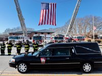 Firefighters from various districts stand at attention in front of the Somerset fire station, as the hearse drives past after the funeral mass of Somerset Fire Chief Scott Jepson held at Saint Thomas More Church on Luther Avenue in Somerset.  Chief Jepson was then buried at the Nathan Slade Cemetery in Somerset.  PHOTO PETER PEREIRA