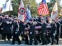 Pallbearers carry the casket of Somerset Fire Chief Scott Jepson for the funeral mass held at Saint Thomas More Church in Somerset.  Chief Jepson was then buried at the Nathan Slade Cemetery in Somerset.  PHOTO PETER PEREIRA