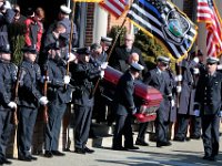 Pallbearers carry the casket of Somerset Fire Chief Scott Jepson out of Saint Thomas More Church in Somerset.  Chief Jepson was then buried at the Nathan Slade Cemetery in Somerset.  PHOTO PETER PEREIRA